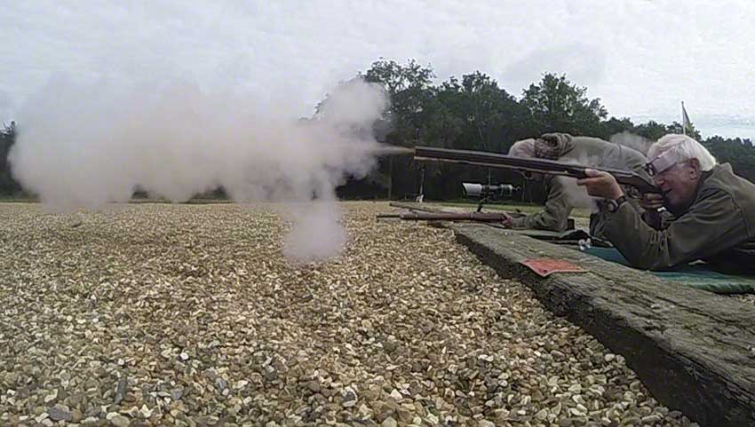 Big-game rifle: Smoke and debris emerge.