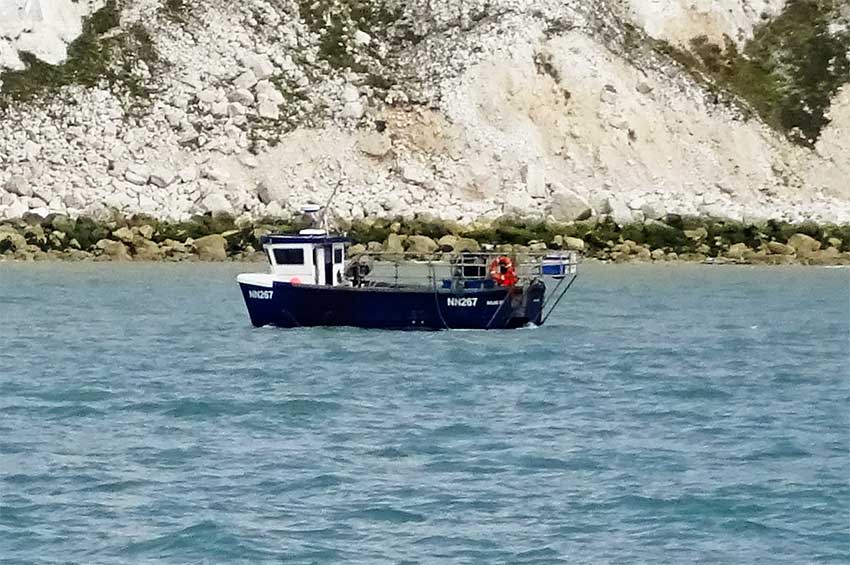 Watchful fishing boat near Beachy head